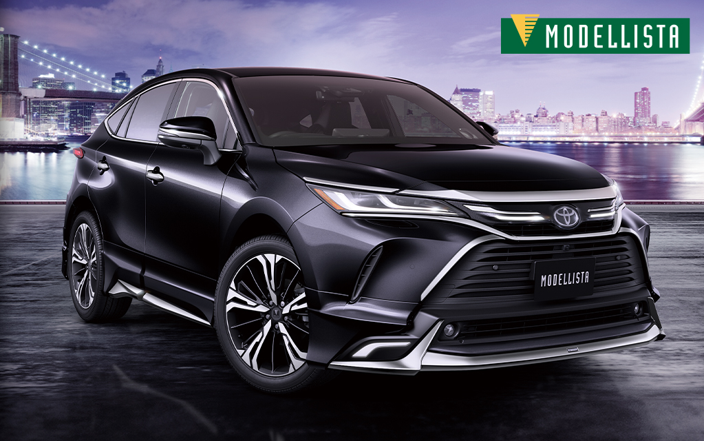 港の背景の中に黒いトヨタ ハリアーmodellistaの外観イメージ画像